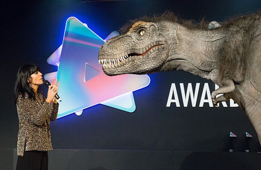 Dean Russell Attends BASE Awards As Judge - On Stage Image Of Claudia Winkleman & T-Rex From Jurassic World