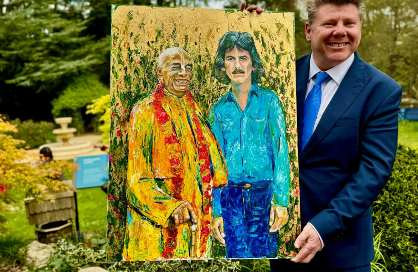 Dean Russell MP presents painting 
