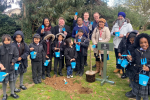 Dean Russell planting apple trees at Stanborough Primary School